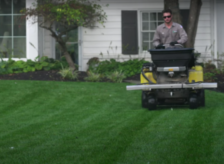 Lawn care technician evaluating a lawn in Lancaster or Harrisburg